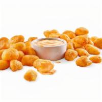 Large Cheddar Cheese Curds · WISCONSIN WHITE CHEDDAR CHEESE CURDS / BATTERED / SOUTHWESTERN RANCH.