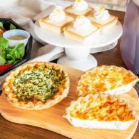 Cafe Classics For 4 · A tasty menu of items for their special day: two homemade quiche, a strawberry bacon spinach...