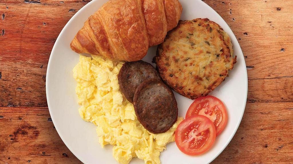 Country French Breakfast · Two eggs cooked-to-order with a Potato Galette, bacon or sausage and a freshly-baked butter croissant.