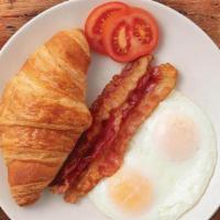 American Breakfast · Two eggs cooked-to-order, bacon or sausage, and freshly-baked butter croissant.