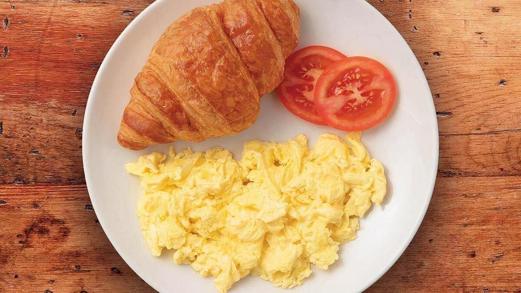 Two Eggs Any Style · Two eggs cooked-to-order with a freshly-baked butter croissant.