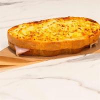 Croque Monsieur · Savory sliced smoked ham and Swiss topped with garlic cream sauce baked on new country bread...