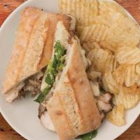 Chicken Caesar Sandwich · Shaved, balsamic-marinated chicken and our famous Caesar Salad with Swiss and mayonnaise bak...