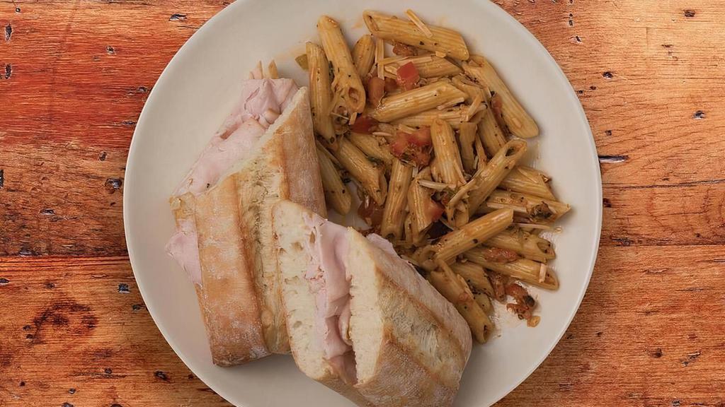 Turkey Bistro · A sandwich made with smoked turkey, crisp bacon and provolone with sun-dried tomato pesto baked on a baguettine served with your choice of one signature side.