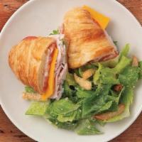 Turkey & Cheese Croissant · Turkey, cheddar, tomato, spring mix, and mayonnaise on an all butter croissant.