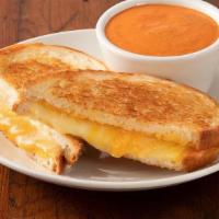 Grilled Cheese Sandwich · Cheddar, Provolone, Swiss and Parmesan cheese melted between two slices of butter toasted co...