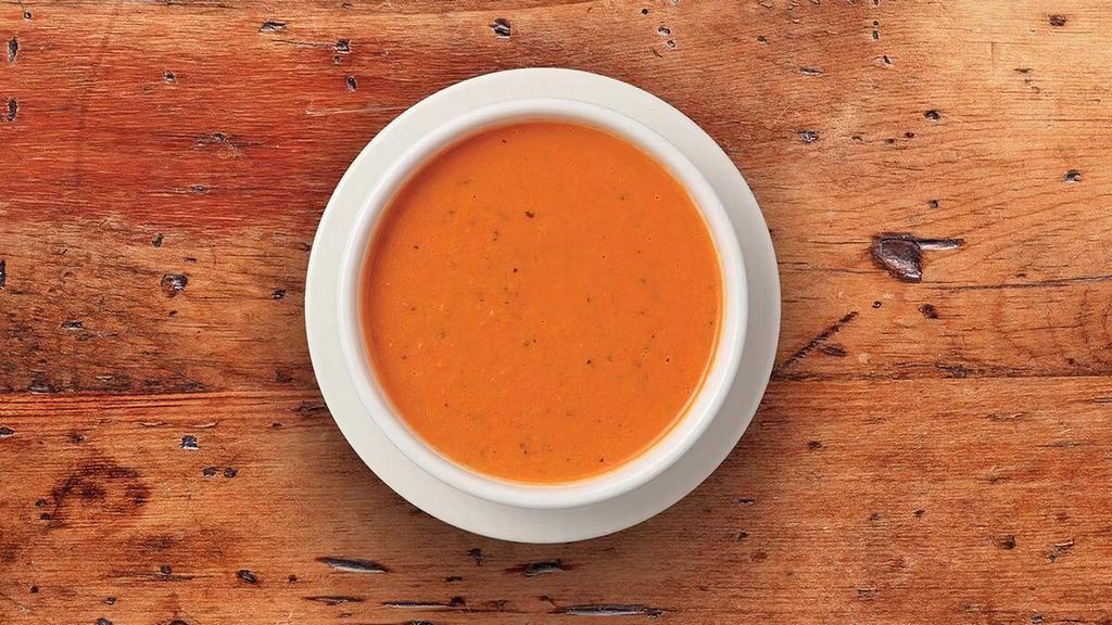 Tomato Basil Soupe · Our signature soupe – a hearty cream based vegetarian (not vegan) soupe made with juicy, vine ripened tomatoes, fresh cream, and fresh basil.