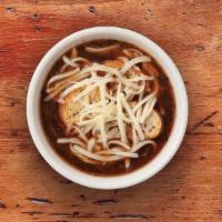 French Onion · Our beef broth based soupe filled with tender onions and flavorful spices. Garnished with Sw...