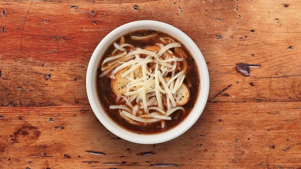 French Onion · Our beef broth based soupe filled with tender onions and flavorful spices. Garnished with Swiss cheese and croutons.