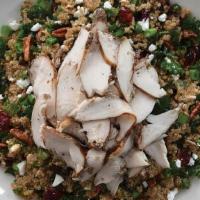 Seasonal Kale & Quinoa Salade · Cranberries, oven roasted pecans, green onions, feta, kale and quinoa tossed in balsamic vin...