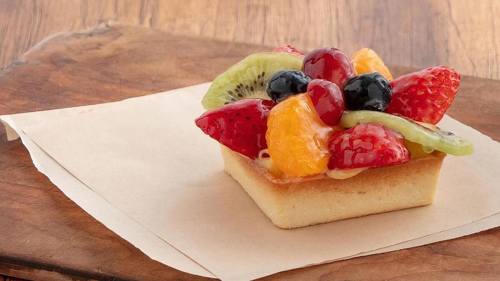 Fresh Fruit Tart · Flaky vanilla pastry shell filled with smooth vanilla pastry cream and topped with seasonal fresh fruit and an apricot glaze.