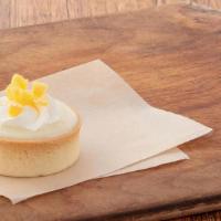 Lemon Tart · Flaky vanilla pastry shell with a sweet and tart creamy lemon filling, topped with a rosette...