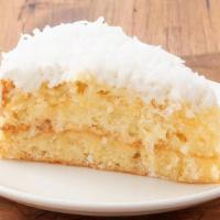 Coconut Cream Cake · Our moist coconut syrup-soaked white cake filled with creamy coconut custard and sweet toast...