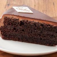 Sacher Torte · Our Sacher Torte with three chocolate cake layers soaked with vanilla syrup and filled with ...