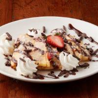Strawberry Nutella Crepe · Strawberries and cream topped with drizzled Nutella®, shaved chocolate and whipped cream.