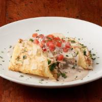 Crepe La Madeleine · Balsamic-marinated chicken, rice Provencal, broccoli and Swiss cheese. Topped with mushroom ...