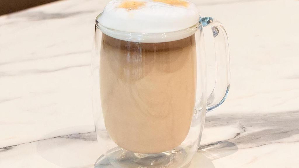 Café Latte · Espresso, steamed milk topped with froth. Finished with cinnamon or cocoa upon request.