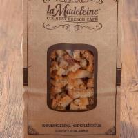 Croutons · Our sourdough and wheat bread baked until crisp and seasoned with garlic.