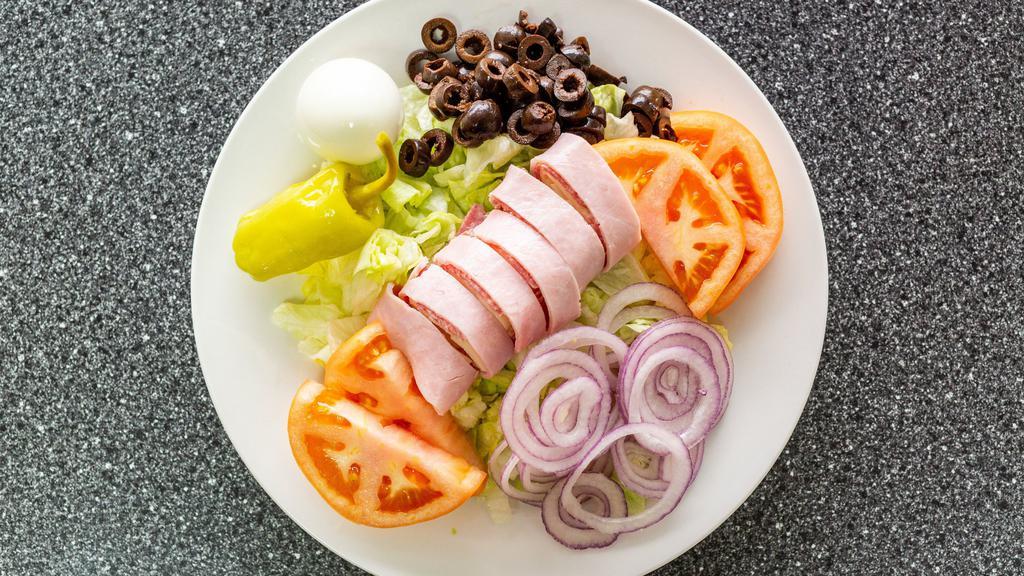 Antipasto Salad · Lettuce with salami, ham, provolone, boiled egg, pepperoncini, tomato, red onion and black olives