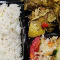 Curry Chicken · Served with your choice of rice and cabbage