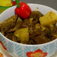 Curry Goat · All meals are served with your choice of rice and cabbage.