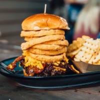 Hickory · Half pound burger, bbq sauce, Cheddar, bacon, onion rings, dressed (no red onion), brioche b...