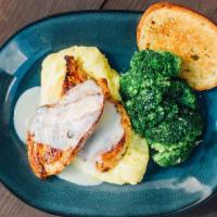 Lemon Butter Chicken · Grilled chicken breasts, lemon butter, corn grits, broccoli