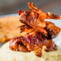 Voodoo Shrimp And Grits · Chargrilled jumbo gulf shrimp stuffed with cream cheese, pickled jalapeños, wrapped in bacon...