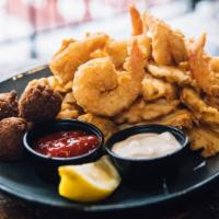 Fried Jumbo Shrimp · Gulf caught, hand battered, waffle fries, hush puppies, with cocktail and tartar.
