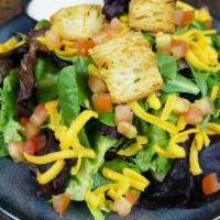 Side Salad · Spring mix, romaine, tomatoes, cheddar cheese, croutons