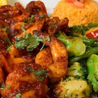 Camarones A La Diabla · Fresh shrimp grilled in a spicy special 'diablo sauce'. Served with Mexican rice, steamed ve...