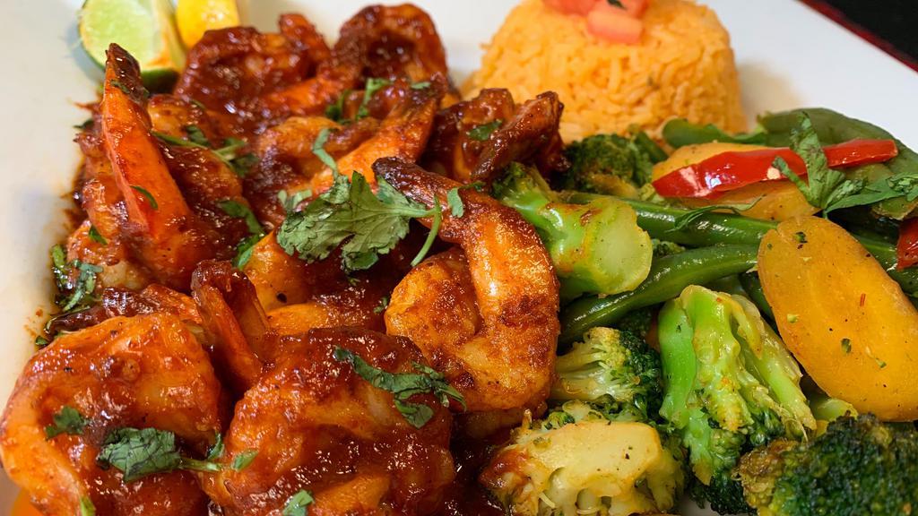 Camarones A La Diabla · Fresh shrimp grilled in a spicy special 'diablo sauce'. Served with Mexican rice, steamed vegetables, and garlic bread.