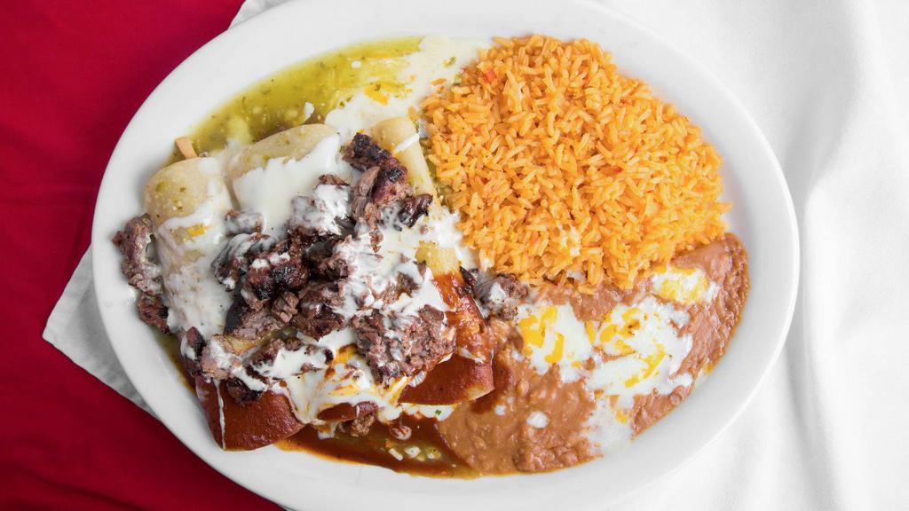 Enchiladas Al Carbon · (3) Cheese enchiladas topped with carne asada. Served with rice, beans, lettuce, sour cream, and pico de gallo. Topped with cheese dip and red or green salsa.