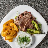 Beef Arrachera · Grilled flank steak served over green onions with rice, charro beans, guacamole, and tortill...