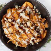 Bleu Cheese Chips · Fresh-cut chips, lightly baked with bleu cheese crumbles, fresh rosemary and thyme with a si...