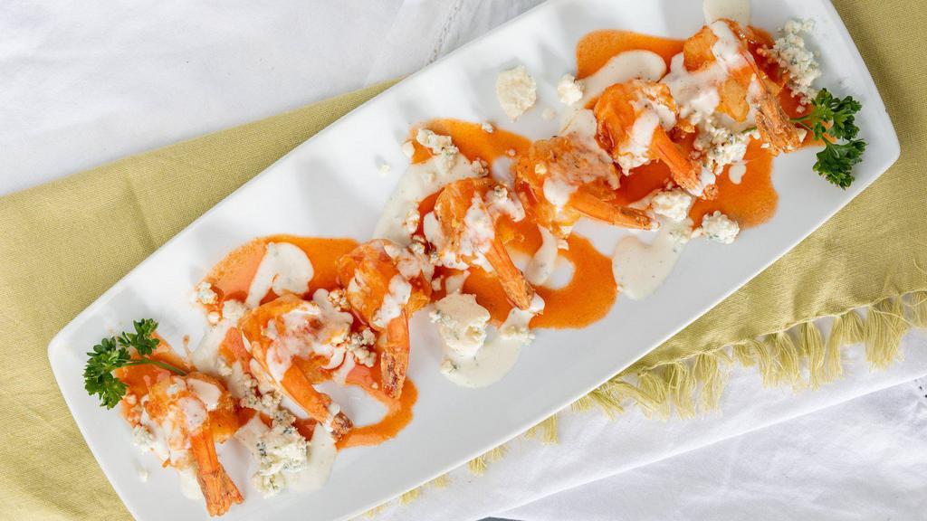 Buffalo Shrimp · Lightly seasoned, flash fried topped with crumbled blue cheese and  a side of blue cheese aioli and mild buffalo sauce.