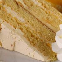 Florida Orange Cake · Decadent four layer cake, orange Bavarian cream, shaved white chocolate and a side of  whipp...