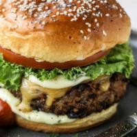 La Maison Special Burger · 8 oz beef burger patty, cajun fried onion, la maison special dressing, bacon, lettuce, tomat...