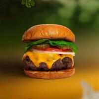 Cheesy Treat Vegan Burger · Seasoned Beyond Meat patty topped with melted vegan cheese, lettuce, tomato, onion, and pick...