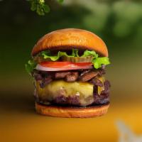 Shroomy Melt Vegan Burger · Seasoned Beyond Meat patty topped with mushrooms, melted vegan cheese, lettuce, tomato, onio...