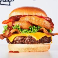 Butch’S Wild Bbq Burger · Burger, BBQ sauce, cheddar cheese, turkey bacon, onion rings, lettuce & tomato