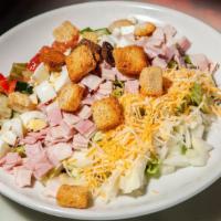 Chef Salad · Ham, turkey, tomato, cucumber, onion, crouton, egg and cheddar cheese on a bed of lettuce.