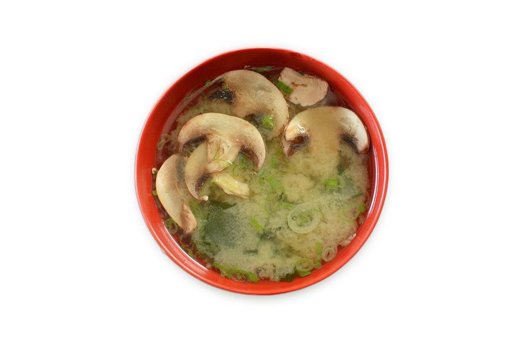 Miso Soup · A traditional Japanese soup consisting of Shiro miso, dashi broth, soft tofu, wakame, mushrooms, and scallions