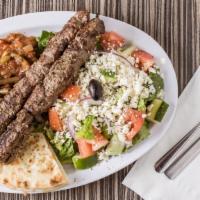 Beef Souvlaki Platter · Two skewers of marinated and grilled beef tenderloins served with pita bread slices, tzatzik...