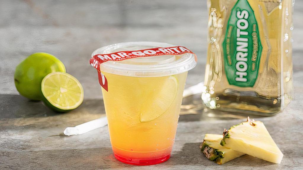 Tropical Sunrise Margarita · Hornitos® Reposado Tequila, DeKuyper® Melon Schnapps, grenadine & pineapple juice shaken 25 times and served  to-go.