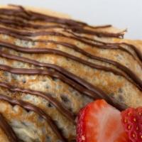 Nutella · Crepe filled with nutella and topped ice-cream with powdered sugar.