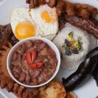 Bandeja Paisa · Typical Colombian plate filled with your choice of meat and served with rice, beans, egg, sw...