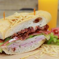 Miami Sandwich  · Jamón regular, jamón de pavo, queso suizo, bacon , tomate, lechuga, mayonesa y papitas frita...