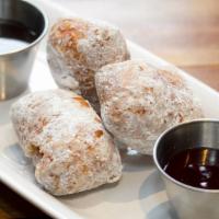 6.9. Donuts  · choose 3, 6, or 9 powdered sugar donuts. served with raspberry + chocolate sauce