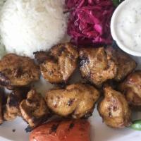 Chicken Sish Kebab · Tangy marinated cubes of chicken thighs skewered and deliciously grilled. Served with rice, ...